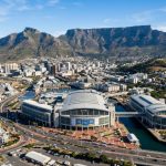 Aerial view of the Cape Town International Convention Centre with Table Mountain in the background, venue of WCPH 2026