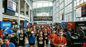 Runners and visitors exploring exhibitor booths at the Marine Corps Marathon Health and Fitness Expo inside the Walter E. Washington Convention Center in 2026